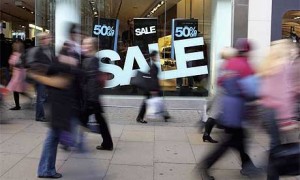 Sale sign at a high street store window in London